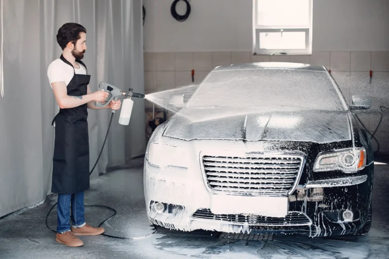 man-washing-his-car-garage