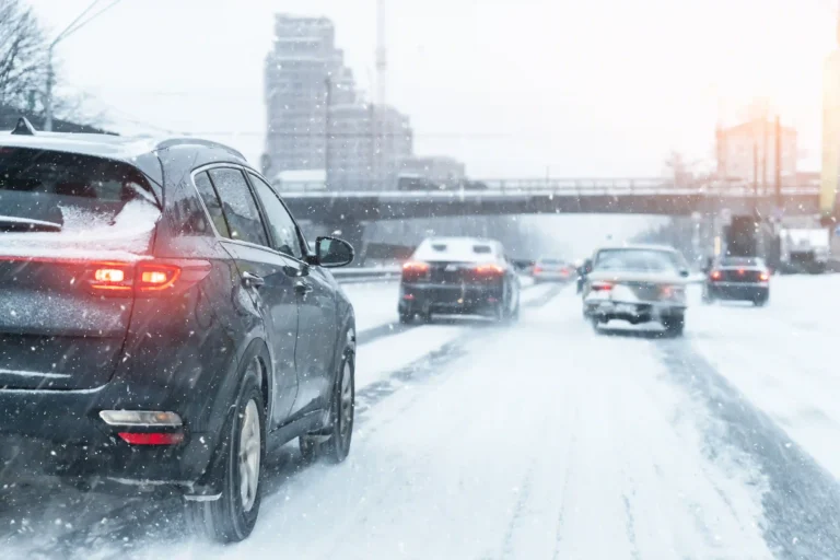 Ceramic coating and PPF winter car care tips for clients - A road full of snow with cars