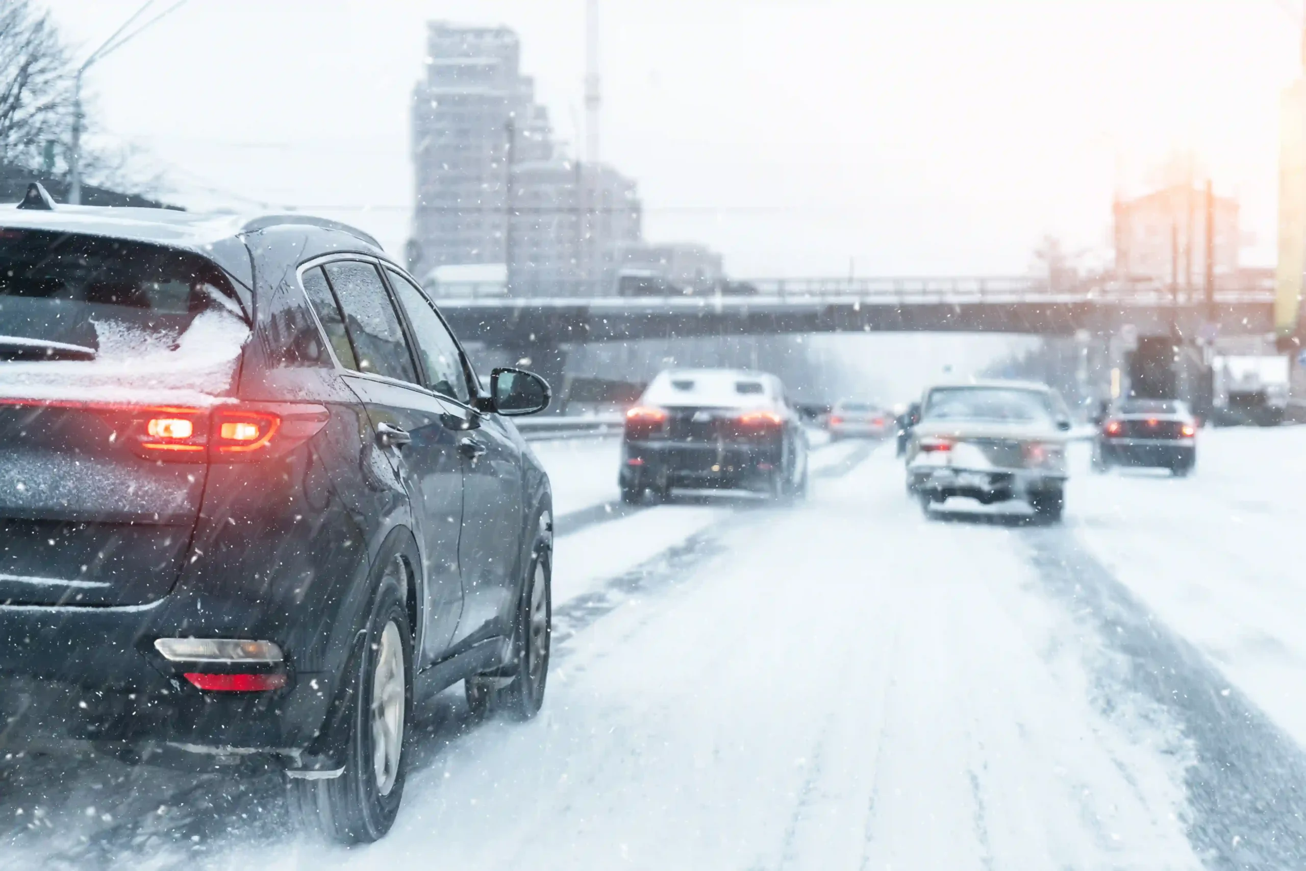 Ceramic coating and PPF winter car care tips for clients - A road full of snow with cars