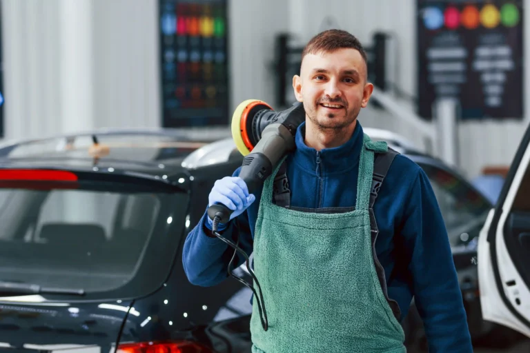 male-worker-uniform-polishing-new-modern-car-conception-service - car care detailers